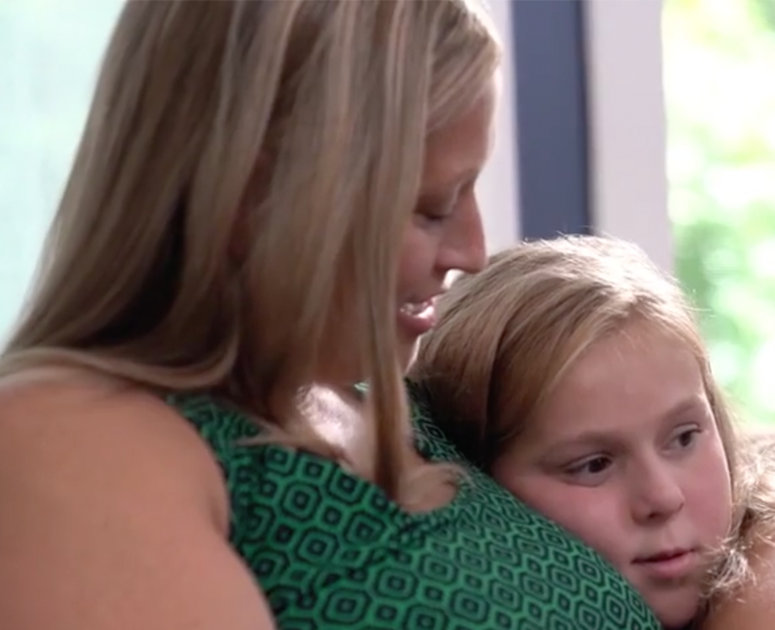 Lindsay snuggling with her older daughter