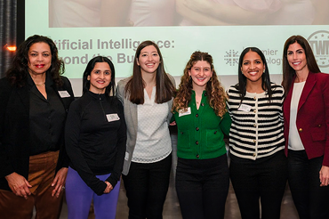 Group photo of women standing in front of backdrop
