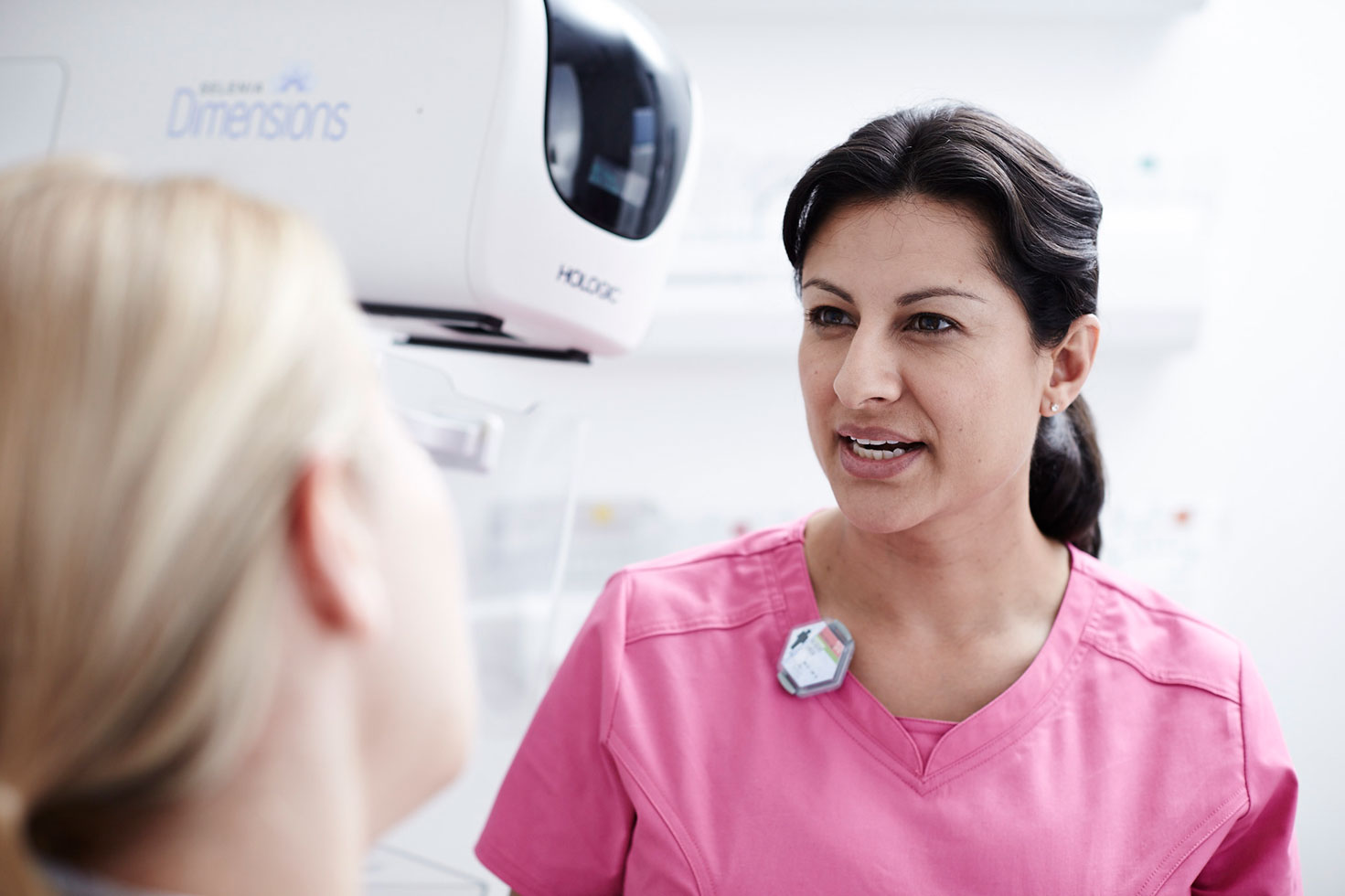 Technician speaking with patient in lab setting