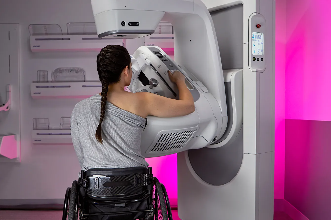 Envision Mammogram machine being used by a patient in a wheelchair