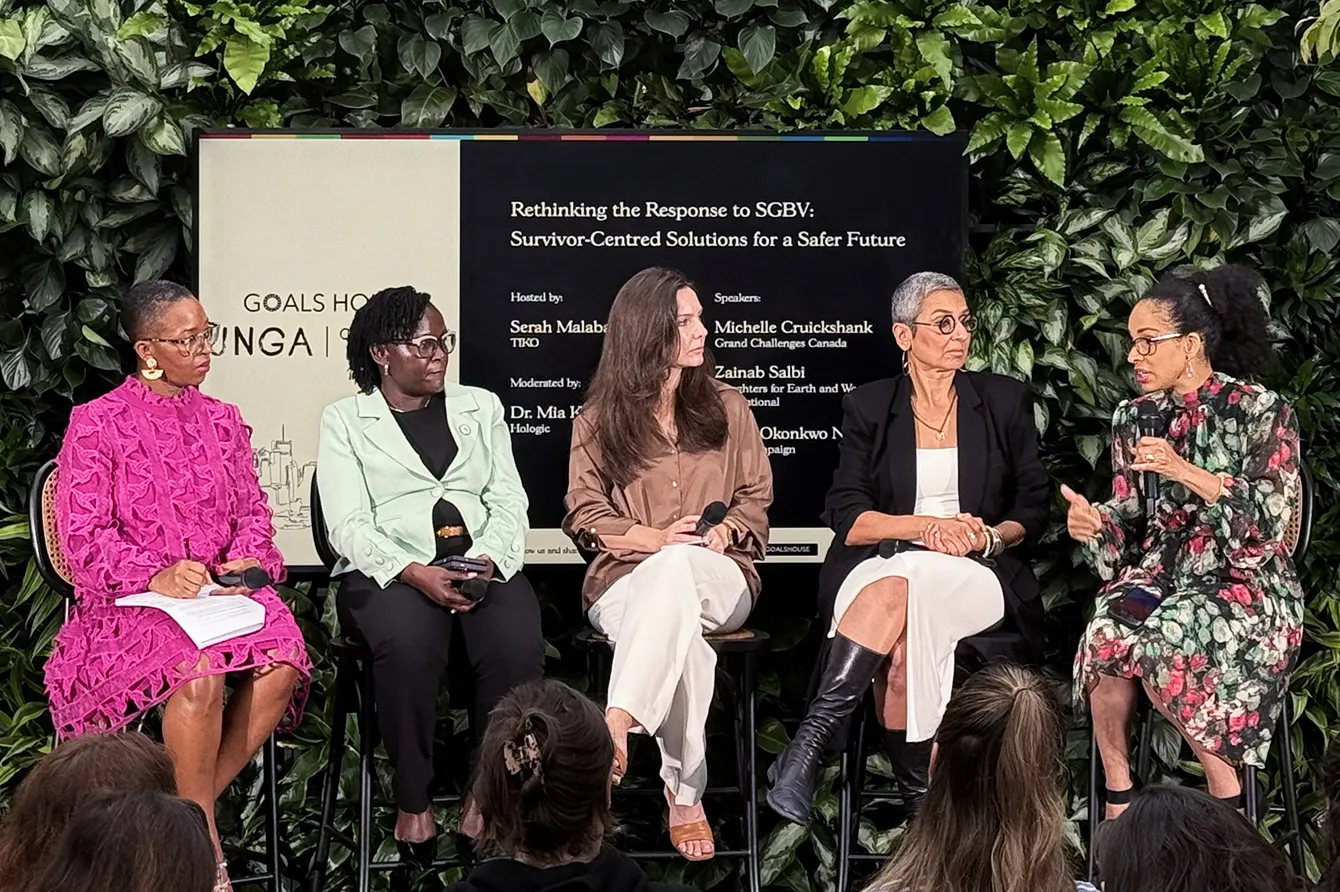 Five women speakers discussing women's health in front of a crowd